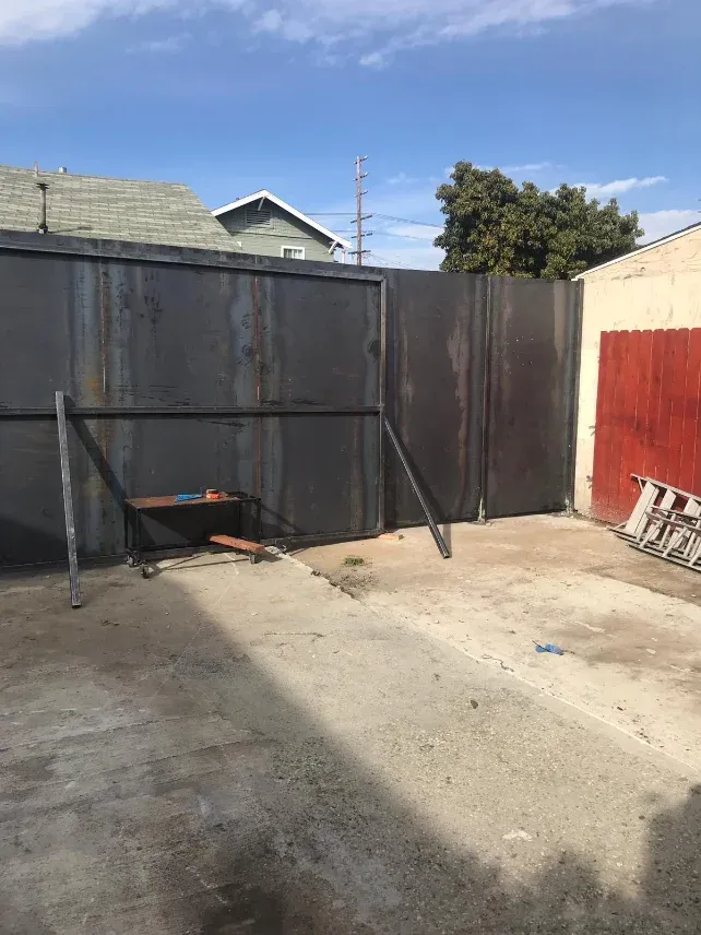 Repaired iron fence run at a private estate
